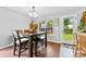 Inviting dining area with hardwood floors and backyard views at 7321 Mapleridge Dr, Charlotte, NC 28210