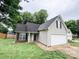 Charming single Gathering home with attached garage, green lawn, and lovely curb appeal with mature trees at 7321 Mapleridge Dr, Charlotte, NC 28210