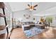 Open-concept living room with hardwood floors and vaulted ceilings at 7321 Mapleridge Dr, Charlotte, NC 28210