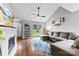 Bright living room with fireplace, hardwood floors, and large window at 7321 Mapleridge Dr, Charlotte, NC 28210