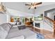 Spacious living room flows into kitchen, featuring a cozy fireplace at 7321 Mapleridge Dr, Charlotte, NC 28210