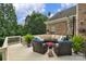 Inviting back deck with comfortable outdoor seating and lush greenery at 7501 Cleyera Cir, Waxhaw, NC 28173
