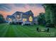 Spacious backyard with a deck and a fire pit area perfect for entertaining guests at 7501 Cleyera Cir, Waxhaw, NC 28173