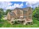 Expansive backyard with well-manicured lawn, deck, and brick exterior at 7501 Cleyera Cir, Waxhaw, NC 28173