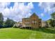 Spacious backyard with a well-maintained lawn and beautiful brick home at 7501 Cleyera Cir, Waxhaw, NC 28173