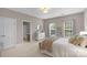 Comfortable bedroom featuring neutral walls, a white dresser, and direct access to an en-suite bathroom at 7501 Cleyera Cir, Waxhaw, NC 28173