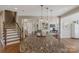 Large kitchen island featuring granite countertops, pendant lighting, and easy access to the living areas at 7501 Cleyera Cir, Waxhaw, NC 28173
