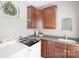 Well-equipped laundry room with modern appliances and ample cabinet space at 7501 Cleyera Cir, Waxhaw, NC 28173