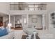 Elegant living room featuring high ceilings, stylish columns, and comfortable seating arrangements at 7501 Cleyera Cir, Waxhaw, NC 28173