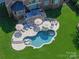Aerial view of a manicured yard with pool, hot tub, and outdoor dining area at 7507 Meadowgate Ln, Waxhaw, NC 28173