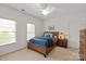 Bright bedroom features neutral walls, carpet, and light wood furniture at 7507 Meadowgate Ln, Waxhaw, NC 28173