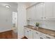 Convenient butler's pantry with granite countertops, custom cabinets, and easy access to the dining area at 7507 Meadowgate Ln, Waxhaw, NC 28173