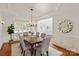 Formal dining room with decorative ceiling, hardwood floors, and ample seating for elegant dinners at 7507 Meadowgate Ln, Waxhaw, NC 28173