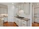 Well-appointed kitchen with custom cabinets, granite countertops, and modern appliances for culinary enthusiasts at 7507 Meadowgate Ln, Waxhaw, NC 28173