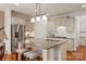 Bright kitchen features stainless steel appliances, granite countertops, and a kitchen island with stool seating at 7507 Meadowgate Ln, Waxhaw, NC 28173