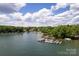 Wide aerial shot of a lake with waterfront homes, private docks, and beautiful wooded surroundings at 8024 Bradford Ln, Denver, NC 28037