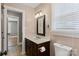 A cozy bathroom offers a stylish vanity and neutral fixtures at 8024 Bradford Ln, Denver, NC 28037