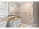 Bathroom with white vanity, granite countertop, and mirrored medicine cabinet at 8024 Bradford Ln, Denver, NC 28037