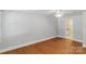 Bedroom featuring hardwood floors and natural light at 8024 Bradford Ln, Denver, NC 28037