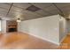 Spacious living room featuring a brick fireplace, neutral walls, and paneled ceilings at 8024 Bradford Ln, Denver, NC 28037