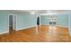 Expansive open-concept living space featuring hardwood floors and natural light at 8024 Bradford Ln, Denver, NC 28037