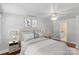 Staged main bedroom with soothing colors, soft lighting, and en suite bathroom at 8024 Bradford Ln, Denver, NC 28037