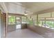 Relax in this sunroom with plenty of natural light and outdoor views at 8024 Bradford Ln, Denver, NC 28037