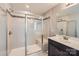 Modern bathroom featuring a glass-enclosed shower, a built-in seat, and a vanity with sleek fixtures at 8726 Addingham Dr, Charlotte, NC 28269
