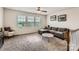 Cozy living room with plush carpeting, a comfortable sofa, and large windows at 8726 Addingham Dr, Charlotte, NC 28269