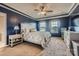 Bedroom features a tray ceiling, two windows, and neutral carpet at 8726 Addingham Dr, Charlotte, NC 28269