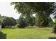 Spacious, level backyard with a wood fence and gate offers a private outdoor space at 9315 Pebble Creek Way, Charlotte, NC 28269