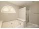 Lovely bathroom featuring a soaking tub and glass shower at 9315 Pebble Creek Way, Charlotte, NC 28269