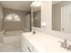 Bright bathroom with a soaking tub, tiled shower and a large double vanity at 9315 Pebble Creek Way, Charlotte, NC 28269