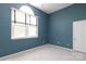 Blue bedroom with ample natural light, window, and closet at 9315 Pebble Creek Way, Charlotte, NC 28269