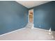 Spare bedroom featuring neutral carpeting and unique access to the staircase at 9315 Pebble Creek Way, Charlotte, NC 28269