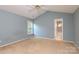 Comfortable bedroom with a ceiling fan, window, and bathroom access at 9315 Pebble Creek Way, Charlotte, NC 28269