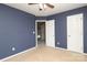 Cozy bedroom with blue walls, standard ceiling fan, and neutral carpet flooring at 9315 Pebble Creek Way, Charlotte, NC 28269