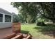 Home featuring wood deck and large backyard at 9315 Pebble Creek Way, Charlotte, NC 28269