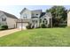 Two-story home featuring a two-car garage and beautifully landscaped front yard at 9315 Pebble Creek Way, Charlotte, NC 28269