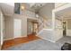 Open foyer with hardwood floors, a staircase, and views to the upstairs landing at 9315 Pebble Creek Way, Charlotte, NC 28269