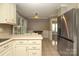 Bright eat-in kitchen featuring stainless steel refrigerator and breakfast nook at 9315 Pebble Creek Way, Charlotte, NC 28269