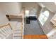 Bright living room boasting vaulted ceilings, many windows, and new gray carpeting at 9315 Pebble Creek Way, Charlotte, NC 28269