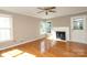 Comfortable living room with hardwood floors and a fireplace at 9315 Pebble Creek Way, Charlotte, NC 28269