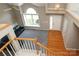 Bright and airy living room showcasing high ceilings and natural light from the large windows at 9315 Pebble Creek Way, Charlotte, NC 28269