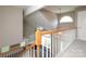 Second story railing overlooking the living room featuring an abundance of natural light at 9315 Pebble Creek Way, Charlotte, NC 28269