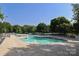Large community pool with plenty of lounge chairs for relaxing and enjoying the sun at 9315 Pebble Creek Way, Charlotte, NC 28269