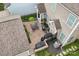 Aerial view of an outdoor patio area with grill and dining set, perfect for entertaining at 10401 Royal Winchester Dr, Charlotte, NC 28277