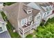 Aerial view showcasing the home's balcony, landscaping, and proximity to neighborhood amenities at 10401 Royal Winchester Dr, Charlotte, NC 28277