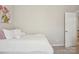 Cozy bedroom featuring a comfortable bed with a decorative floral painting on the wall at 10401 Royal Winchester Dr, Charlotte, NC 28277