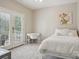 Bedroom featuring a white bed, desk, and french doors leading to a private balcony at 10401 Royal Winchester Dr, Charlotte, NC 28277